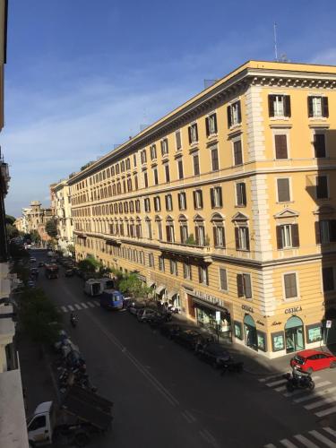 a large building on the side of a street at Just one room in Rome