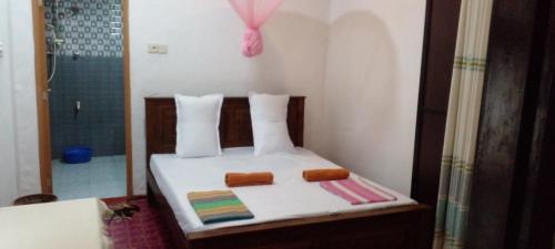 Postel nebo postele na pokoji v ubytování Ajith Rest