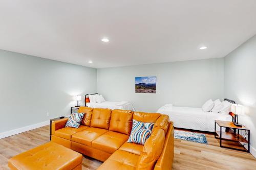 a living room with a couch and a bed at The Retreat at Fern Cove in Pisgah Forest