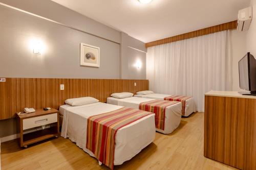 Katil atau katil-katil dalam bilik di Hotel Pires