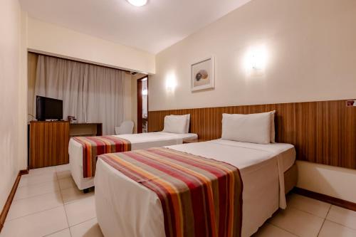 Katil atau katil-katil dalam bilik di Hotel Pires