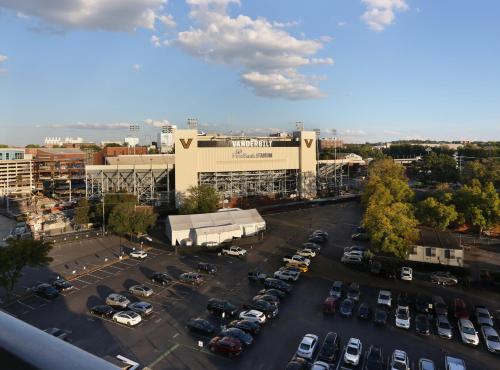 an aerial view of a parking lot in front of a building at Holiday Inn Nashville - Vanderbilt - Dwtn by IHG in Nashville