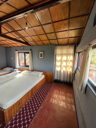 a bedroom with two beds in a room at Bhaktapur Guest House in Bhaktapur