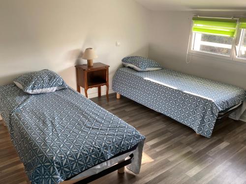 Кровать или кровати в номере Maison familiale La Baie 10 ps en côte de Jade
