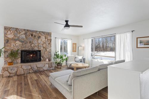 a living room with a couch and a fireplace at Serene Palmer Home Walk to Downtown and Riverfront! in Palmer