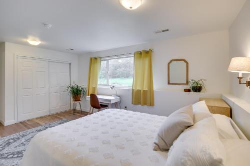 a bedroom with a bed and a desk and a window at Serene Palmer Home Walk to Downtown and Riverfront! in Palmer