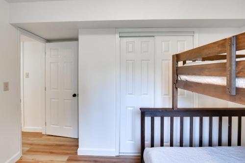 a bedroom with a bunk bed and white walls at Serene Palmer Home Walk to Downtown and Riverfront! in Palmer