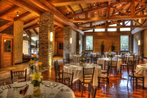 a dining room with tables and chairs in a building at Bosques de Monterreal in Mesa de las Tablas