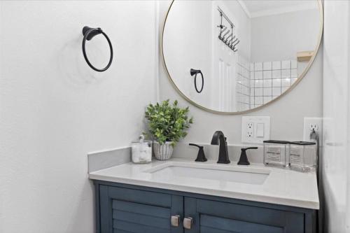 a bathroom with a sink and a mirror at Unit 5: Sun drenched studio with tranquil vibes in Billings