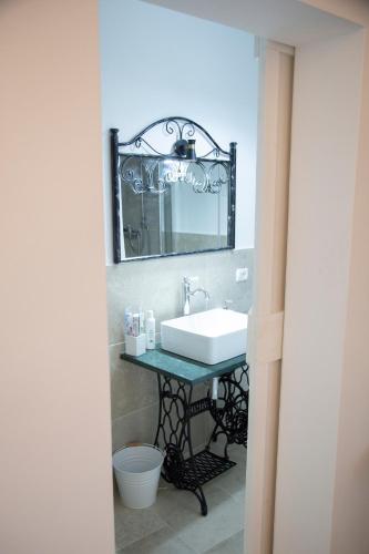 a bathroom with a sink and a mirror at Nonna Veronica in Gemini