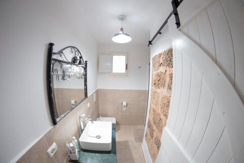 a bathroom with a sink and a mirror at Nonna Veronica in Gemini