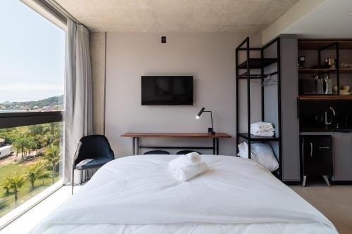 Cama o camas de una habitación en Spot Jurere sofisticación junto al mar - SPJ's