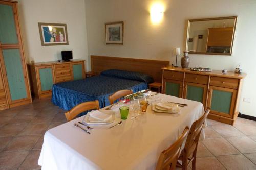 a hotel room with a table and a bed at Locanda Del Re sole in Ferrara