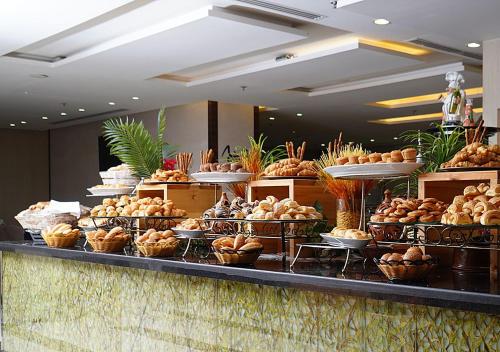 a buffet line with many different types of food at M Hotel Makkah by Millennium in Makkah