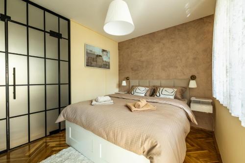 Ένα ή περισσότερα κρεβάτια σε δωμάτιο στο Apartman Sara