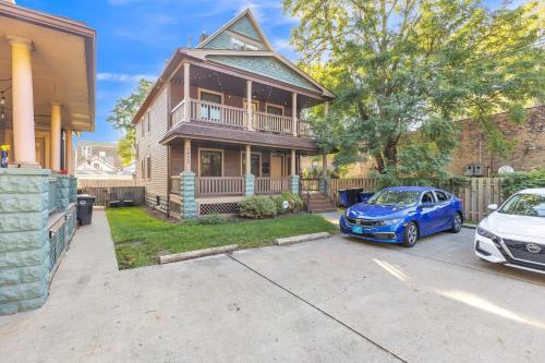 a house with a car parked in front of it at Charming Cleveland Haven Duplex in Cleveland