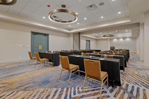 a large room with rows of tables and chairs at Crowne Plaza Houston Med Ctr-Galleria Area by IHG in Houston