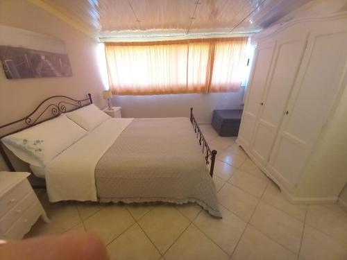 Letto o letti in una camera di Stella Marina Bed and Breakfast sul mare