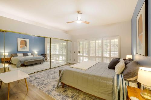 a bedroom with a bed and a large mirror at Rancho Mirage Retreat Pool, Spa and Fireplace! in Rancho Mirage