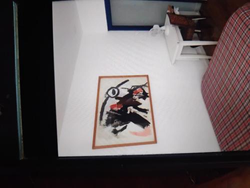 a picture of a samurai on a white wall at Tiny cosy flat in Lisbon
