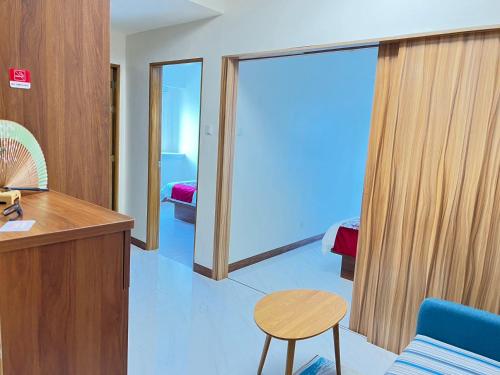 a room with a desk and a table and a chair at Beachfront U.S. Embassy Family Retreat. in Manila