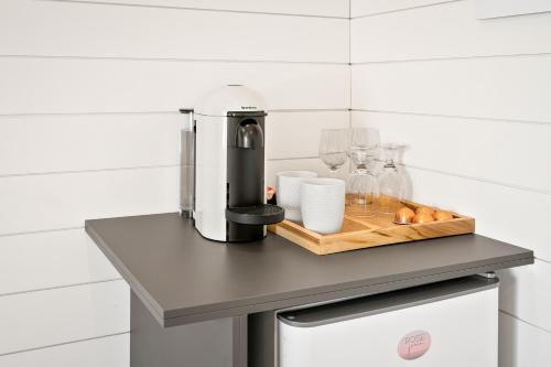 a coffee maker on a counter in a kitchen at Boutique Room steps from Downtown Mall Rose Jean Room 3 in Charlottesville