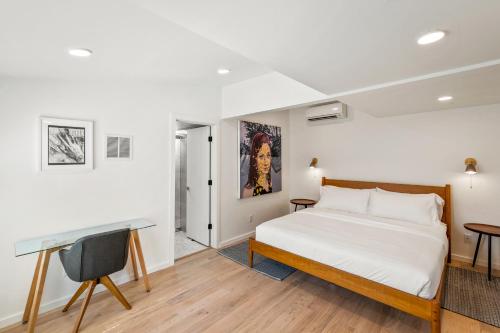 a bedroom with a bed and a desk at Boutique Room steps from Downtown Mall Rose Jean Room 2 in Charlottesville