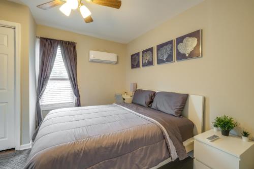a bedroom with a bed and a ceiling fan at Charming Roanoke Vacation Home - 1 Mi to Downtown! in Roanoke