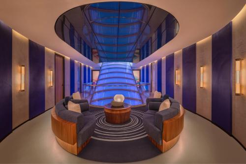 a lobby with two chairs and a water slide at W Sydney in Sydney