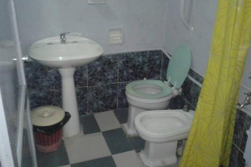a small bathroom with a sink and a toilet at Chalet Milagros in Costa Azul