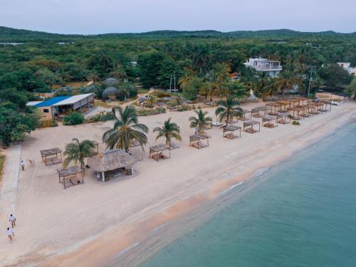 an aerial view of a beach with tables and chairs at Fenix Beach Cartagena in Tierra Bomba