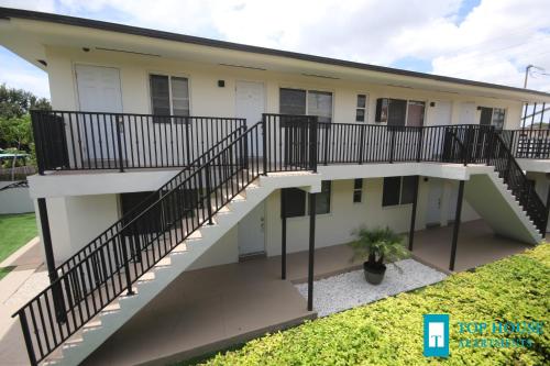 an aerial view of a house with stairs at 251 Airport/Top House Apartments in Miami