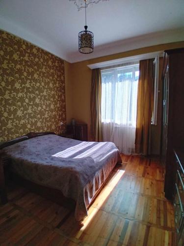 Postel nebo postele na pokoji v ubytování sulkhanihouse