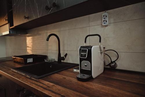 a toaster sitting on top of a kitchen counter at M lux Kragujevac in Kragujevac