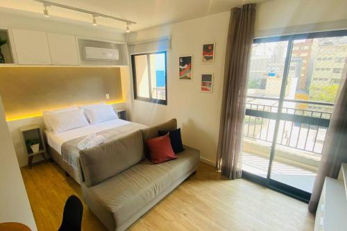 Ένα ή περισσότερα κρεβάτια σε δωμάτιο στο Apartamento encantador no Bairro da Liberdade