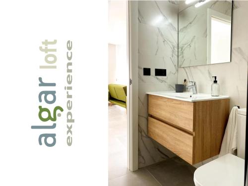 a bathroom with a sink and a mirror at ALGAR LOFT, diseño y climatización in Callosa d'en Sarrià
