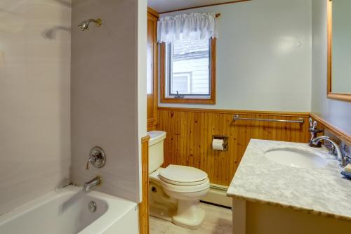 a bathroom with a toilet and a sink and a tub at Centrally Located New Jersey Home with Private Yard in Lambertville
