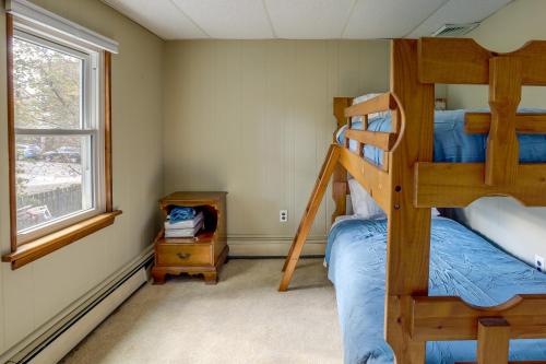 a bedroom with two bunk beds and a window at Centrally Located New Jersey Home with Private Yard in Lambertville