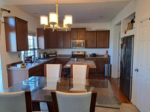 a kitchen with a table and chairs and a dining room at Ram comfort in Denver