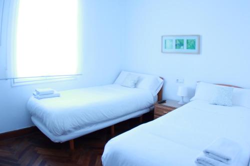 Кровать или кровати в номере Zubia Urban Rooms