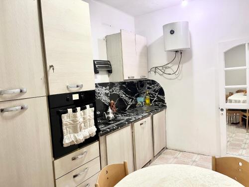 a kitchen with a stove and a counter top at Appartement Bab Lamrissa in Salé