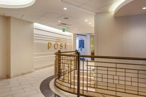 a lobby with a pos sign on the wall at Best Western Premier Park Hotel in Madison