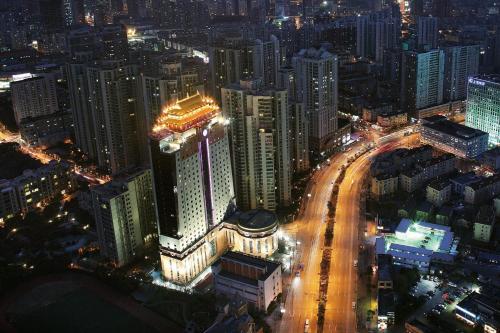 a city lit up at night with buildings and traffic at Courtyard By Marriott Shanghai Xujiahui in Shanghai