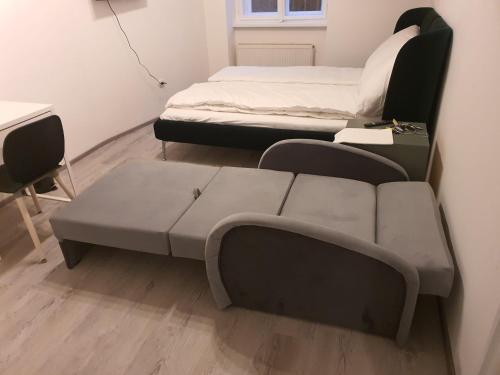 a living room with two beds and a couch at Apart Comfort in Prague