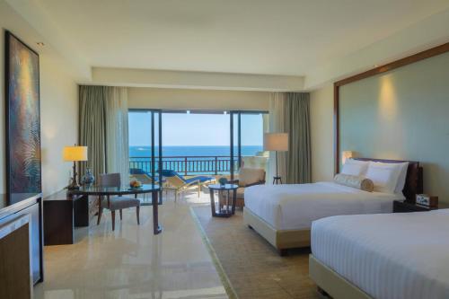 Postel nebo postele na pokoji v ubytování The Ritz-Carlton Sanya, Yalong Bay