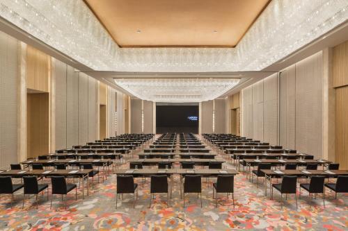 a large room with tables and chairs in it at Le Meridien Suzhou, Suzhou Bay in Suzhou