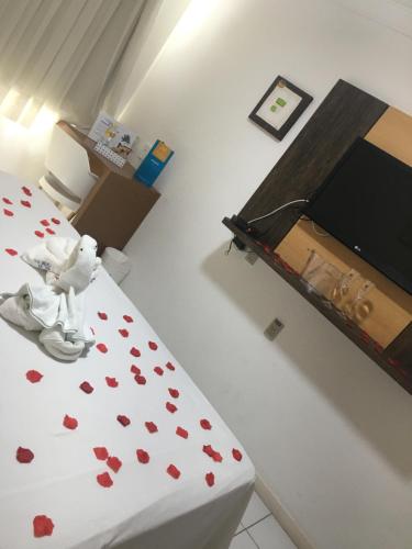 a room with a bed with hearts on it at Ponta Negra Beach luxury hotel in Natal
