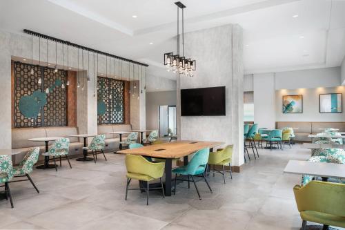 a dining room with a table and chairs at TownePlace Suites by Marriott Nashville Midtown in Nashville