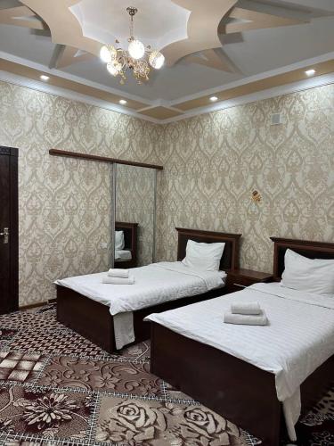 Llit o llits en una habitació de VOSTOK HOTEL