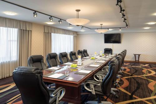 a large conference room with a long table and chairs at Pittsburgh Marriott City Center in Pittsburgh